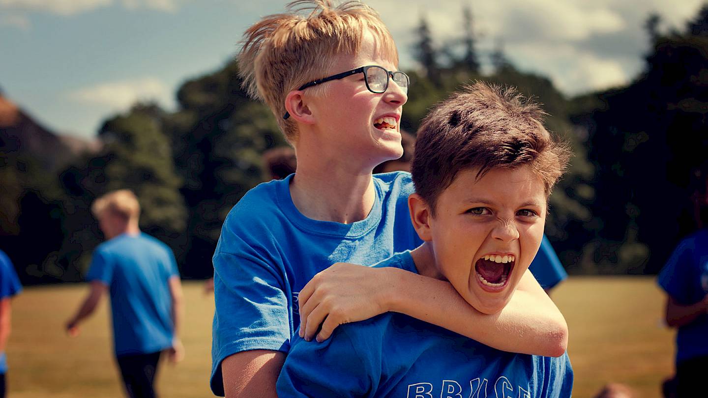 Two ISSFT students celebrating during a Braveheart Challenge