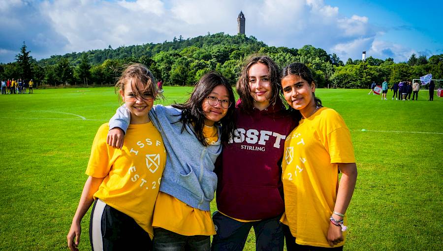 summer school girls standing on sports field