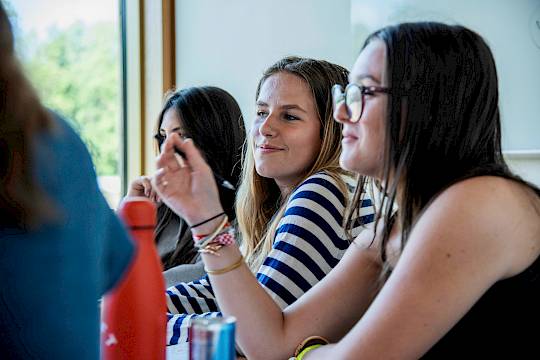 Students in lab coats taking part in a hands-on medical workshop at ISSFT Oxford, representing the launch of the new Introduction to Medicine summer course.