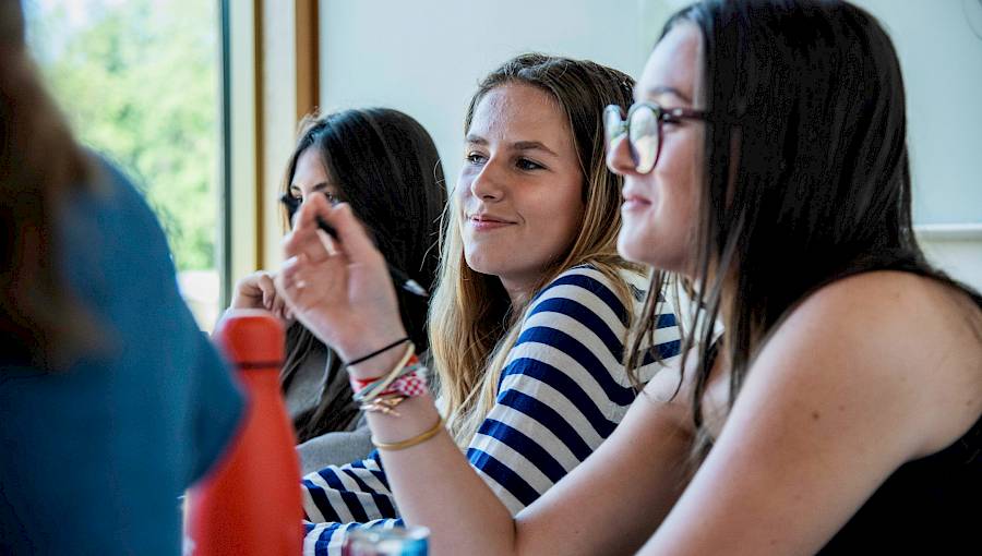 Students in lab coats taking part in a hands-on medical workshop at ISSFT Oxford, representing the launch of the new Introduction to Medicine summer course.
