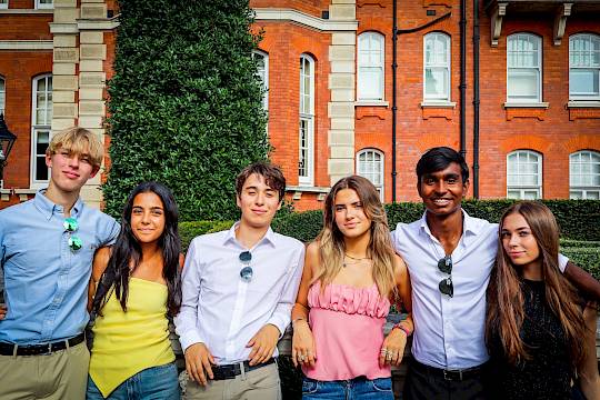 Mixed-nationality group of teenagers participating in an ISSFT team activity, highlighting collaboration and global friendships.