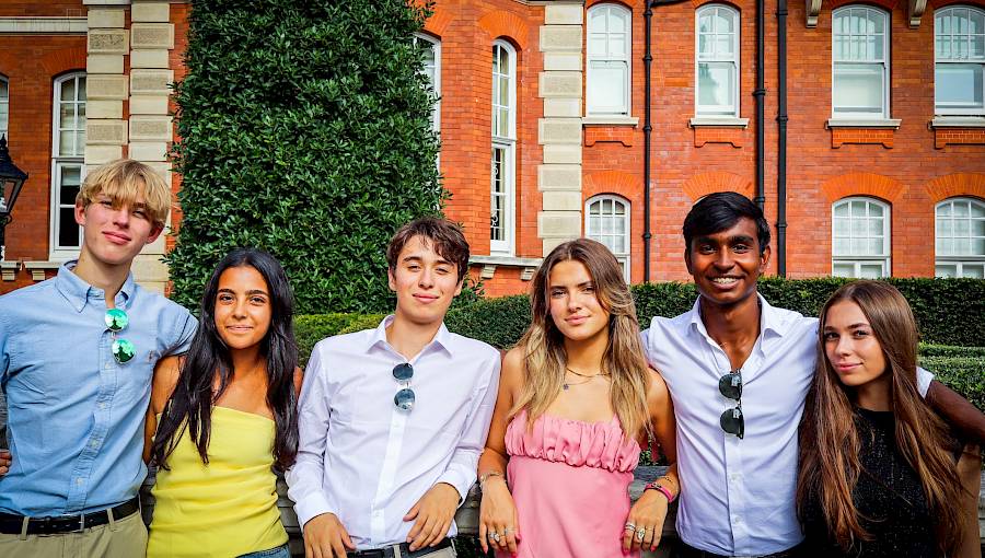 Mixed-nationality group of teenagers participating in an ISSFT team activity, highlighting collaboration and global friendships.