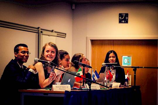 ISSFT students taking part in a Model United Nations session, delivering speeches and negotiating resolutions in a global leadership setting.
