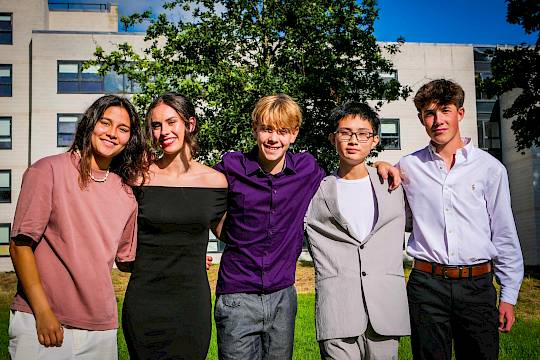 Teenagers attending a university-style academic class at an international summer school