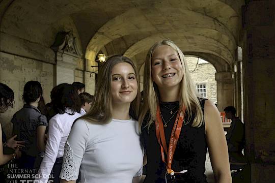 two teenage girls standing in the worcester college cloisters, issft summer school 2026
